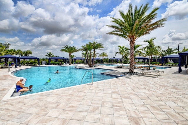 view of swimming pool with a gazebo and a patio