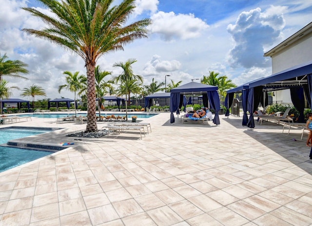 view of pool featuring a gazebo and a patio