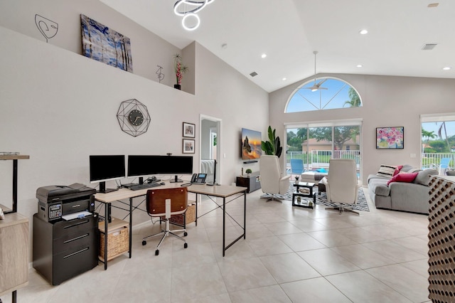 office featuring a wealth of natural light, high vaulted ceiling, ceiling fan, and light tile patterned flooring