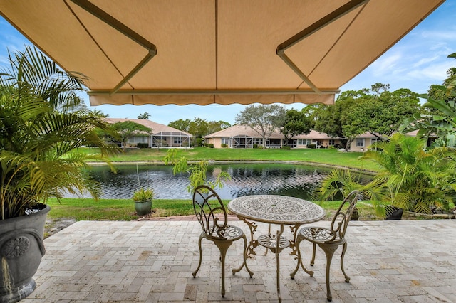 view of patio with a water view