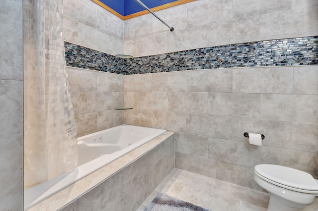 bathroom with shower / bath combo with shower curtain, tile walls, and toilet