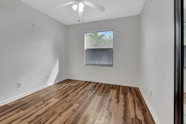 unfurnished room with ceiling fan and hardwood / wood-style floors