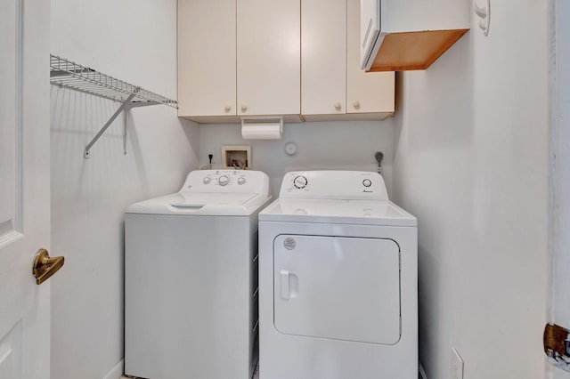 laundry area with cabinets and independent washer and dryer