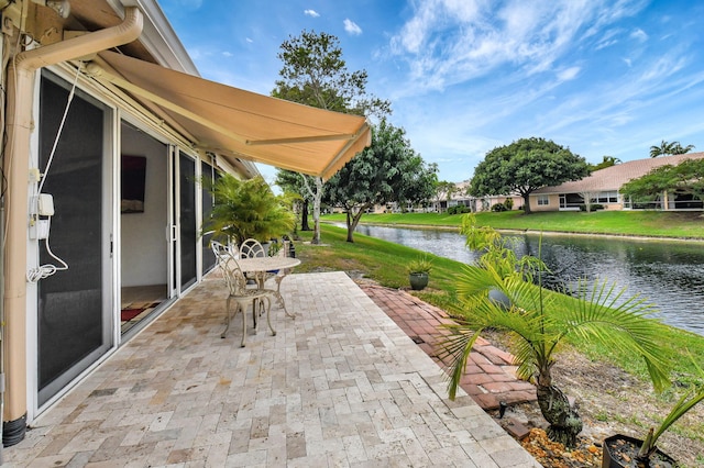 view of patio / terrace featuring a water view