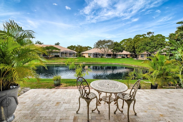 view of patio with a water view