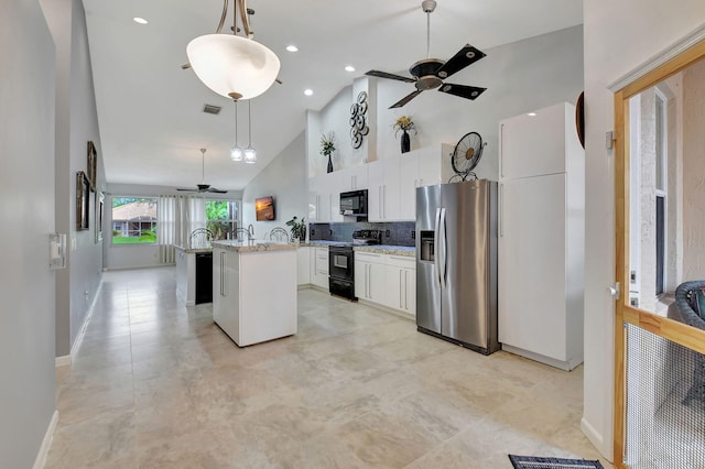 kitchen featuring black appliances, decorative light fixtures, high vaulted ceiling, white cabinets, and a center island