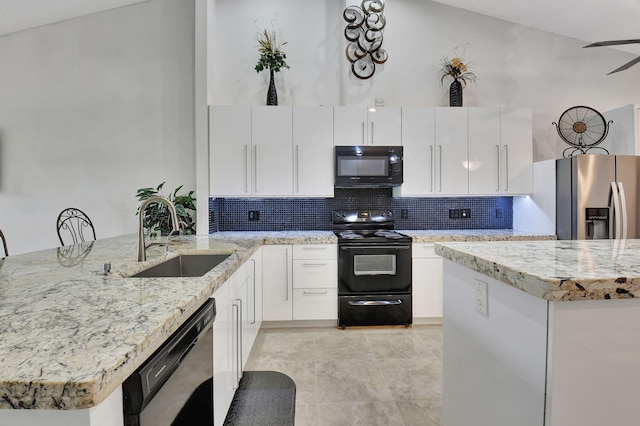 kitchen featuring black appliances, white cabinetry, sink, and tasteful backsplash