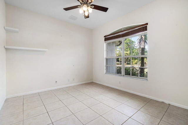 unfurnished room featuring ceiling fan and light tile patterned flooring