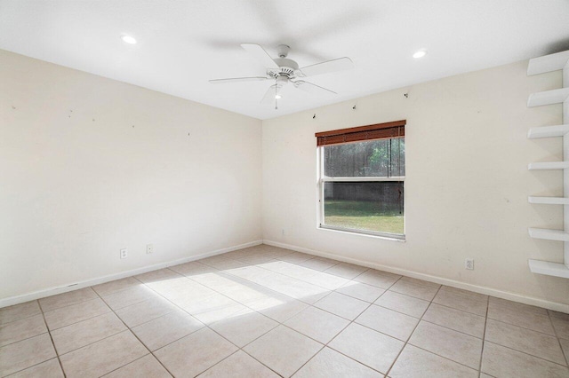 unfurnished room with ceiling fan and light tile patterned flooring