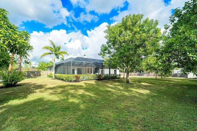 view of yard with a lanai