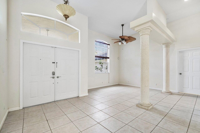 entryway featuring light tile patterned floors, decorative columns, and ceiling fan