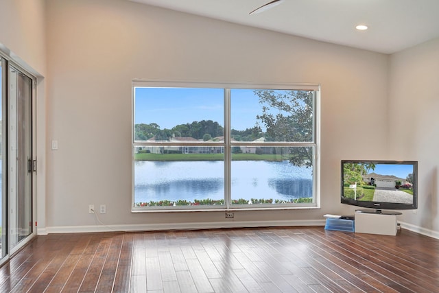 unfurnished living room with lofted ceiling and hardwood / wood-style flooring