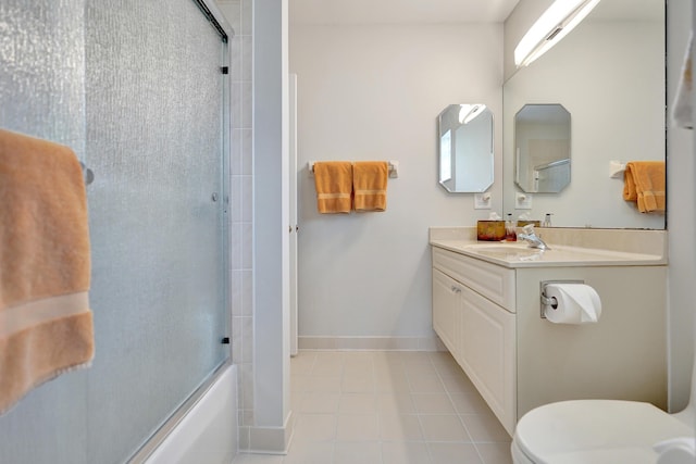 full bathroom featuring vanity, enclosed tub / shower combo, and toilet