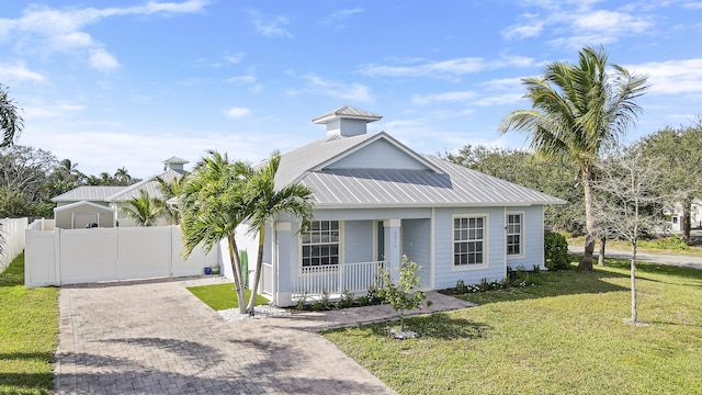 view of front of home with a front yard and a porch