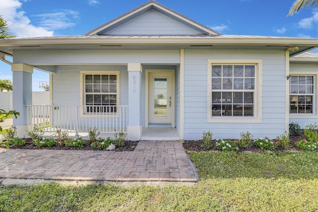 property entrance featuring covered porch