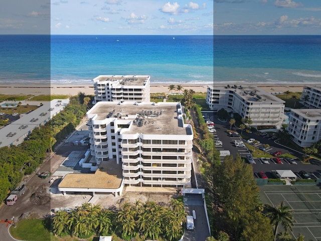 bird's eye view featuring a water view and a view of the beach