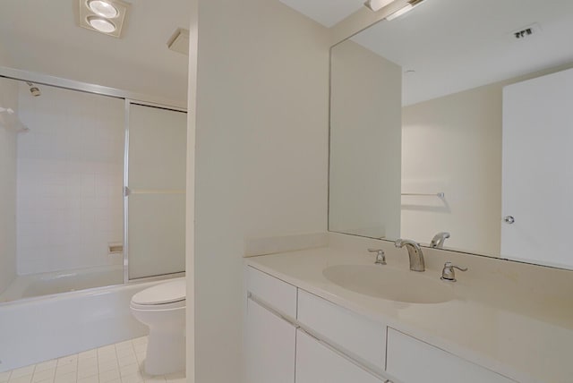 full bathroom featuring tile patterned flooring, vanity, shower / bath combination, and toilet