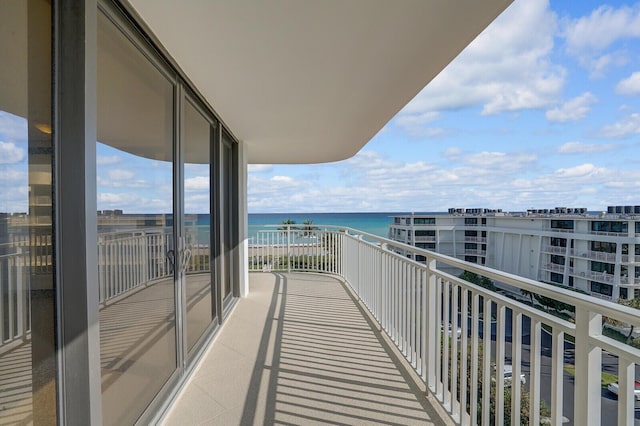 balcony featuring a water view