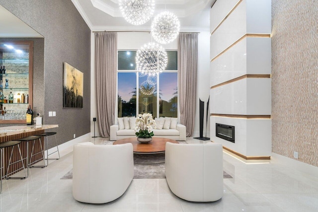 living room with an inviting chandelier, ornamental molding, and indoor bar