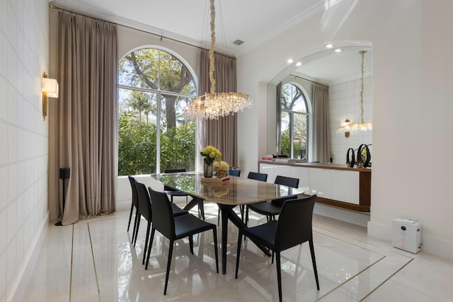 dining room featuring ornamental molding, recessed lighting, and a notable chandelier