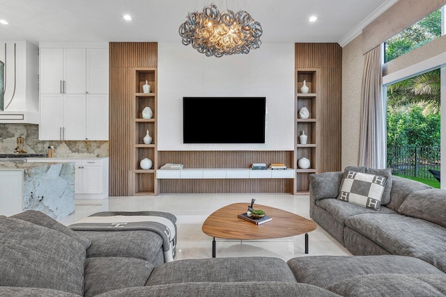 living room with an inviting chandelier and built in shelves