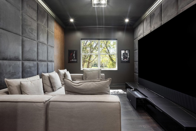 home theater with ornamental molding, dark wood-style flooring, and recessed lighting