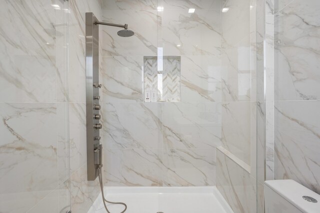 bathroom with vanity, plus walk in shower, tile walls, and a wealth of natural light