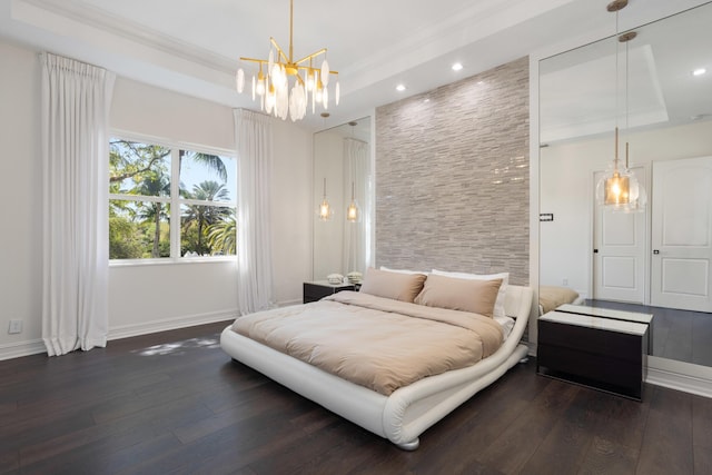 bedroom featuring baseboards, a raised ceiling, and dark wood-style flooring