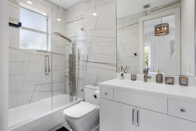 bathroom with visible vents, plenty of natural light, vanity, and toilet