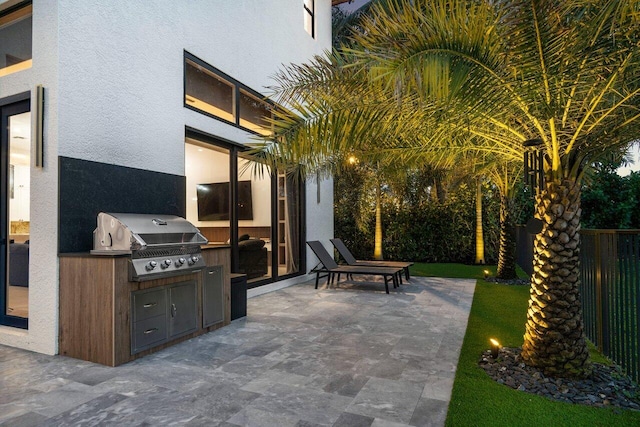 view of patio with fence and area for grilling