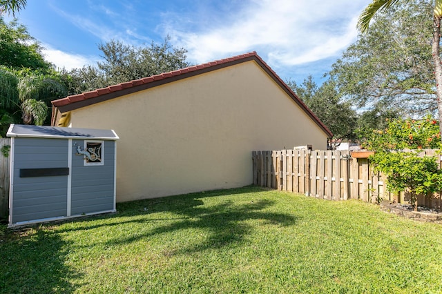 exterior space with a storage shed