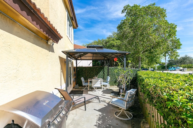 view of patio with a gazebo and a grill