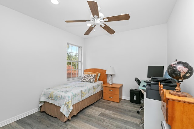 bedroom with wood-type flooring and ceiling fan