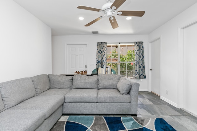 living room featuring ceiling fan