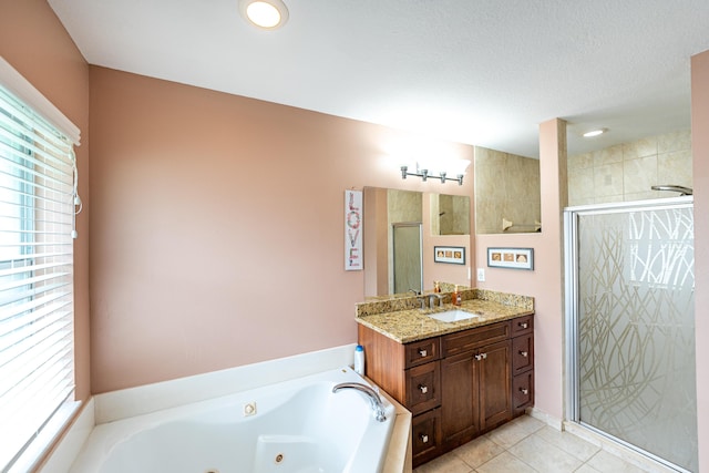 bathroom featuring tile patterned floors, vanity, and independent shower and bath