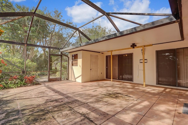 view of patio / terrace featuring glass enclosure