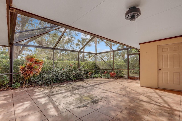 view of patio featuring a lanai