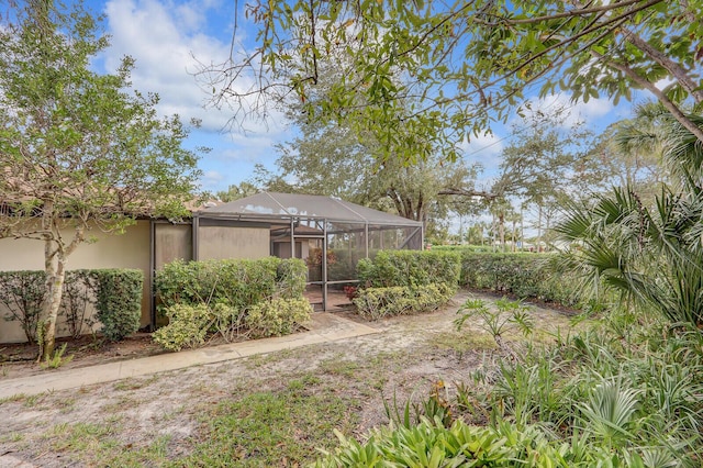 view of yard with a lanai