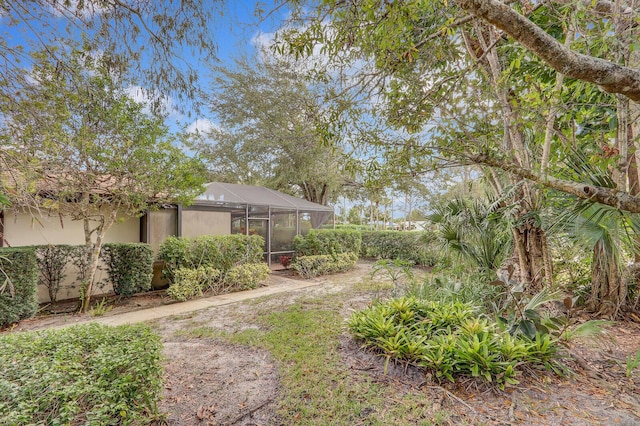 view of yard with a lanai