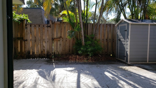 view of patio / terrace featuring a storage shed