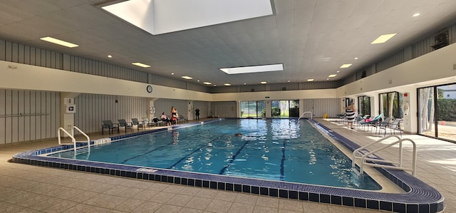 view of pool featuring a skylight