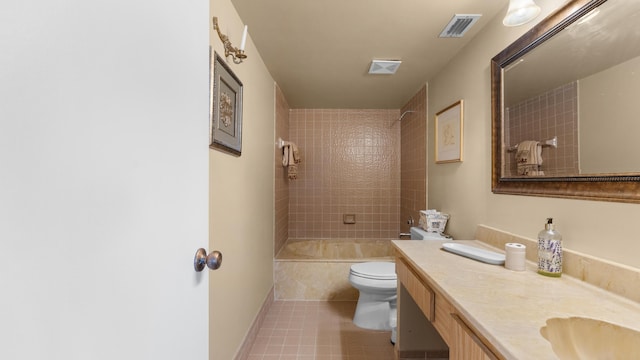 full bathroom featuring tile patterned flooring, vanity, toilet, and tiled shower / bath combo