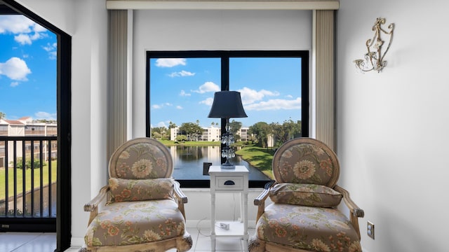 living area with a water view and a wealth of natural light