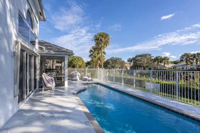 view of pool featuring a fenced in pool, a patio, and fence
