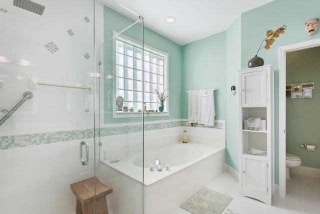 bathroom with tile patterned flooring, separate shower and tub, and toilet