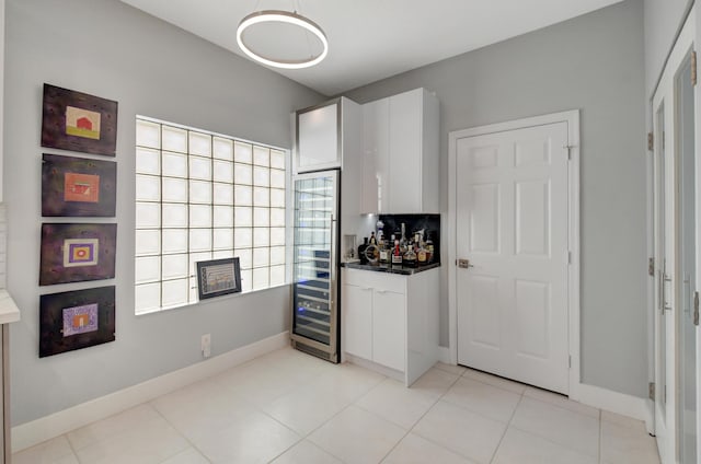 kitchen with white cabinetry and light tile patterned flooring