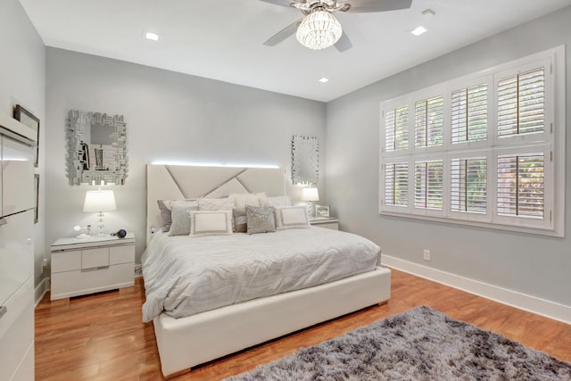 bedroom featuring ceiling fan and light wood-type flooring