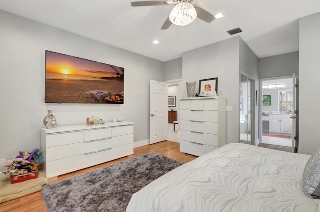 bedroom with connected bathroom, ceiling fan, and light wood-type flooring