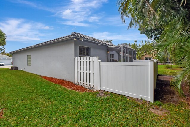 view of property exterior with a lawn