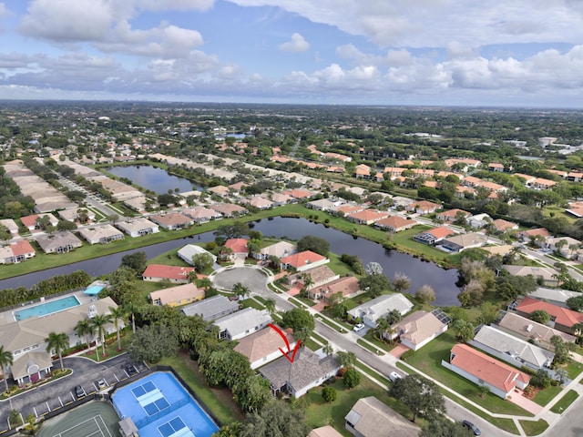 birds eye view of property featuring a water view